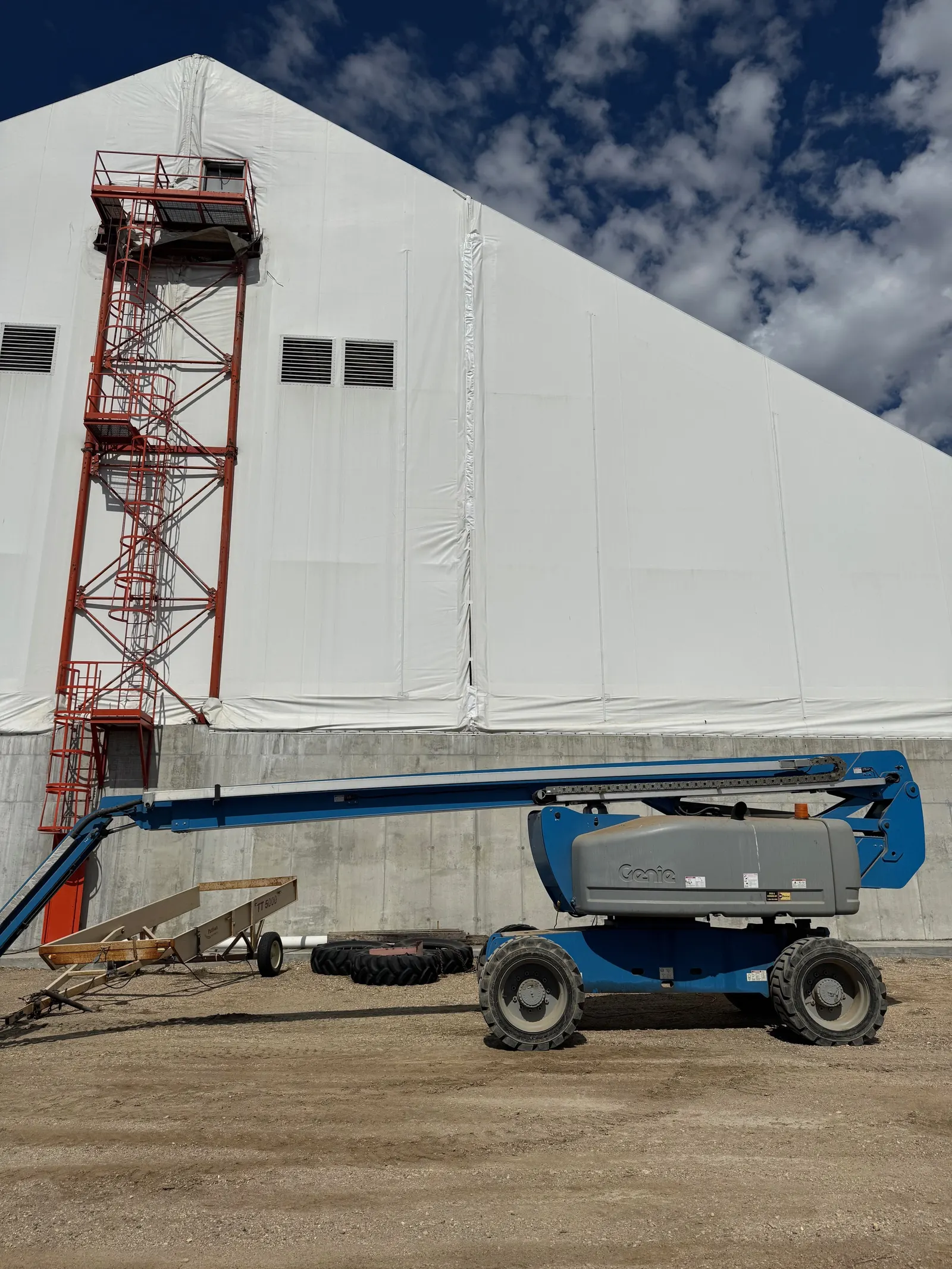 S&T crew working at height on a fabric building wall
